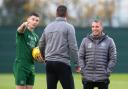 Kieran Tierney alongside Celtic boss Brendan Rodgers and assistant John Kennedy