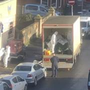 WATCH: Cops in hazmat suits remove huge cannabis plants after raid in residential area