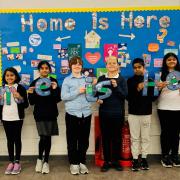 Children at Oakgrove Primary celebrate their successful Home is Here project