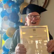 Gordon Moore with his certificate