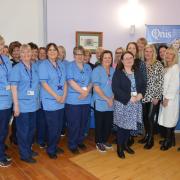 Jacqueline Meek, second from the right on the front row, with colleagues at the Queen’s Nursing Institute Scotland award for long service celebration event