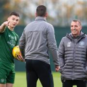 Kieran Tierney alongside Celtic boss Brendan Rodgers and assistant John Kennedy