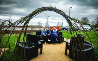 Enjoying the new outdoor space arch are, from left, Registered Nurse Emma Harper, Support Worker Audrey Duncan and Registered Nurse Charanne Edgar, all members of the TAN (Therapeutic Activity Nursing) Team at the Mental Health Campus