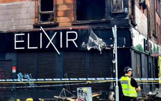 Police probe launched after fire rips through building