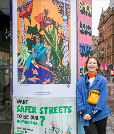 Glasgow Times: Molly Hankinson alongside one of the poster from the collection.
