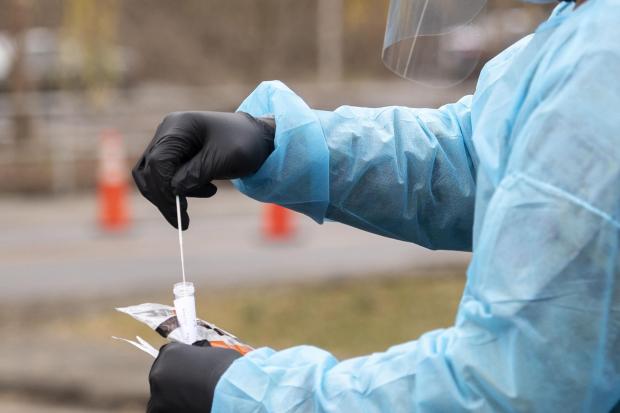 The Virginia National Guard conducts free COVID-19 testing in the Cumberland Square Park parking lot in Bristol, Va., on Friday, Dec. 18, 2020. The Mount Rogers Health District and the Virginia National Guard have been testing throughout Southwest