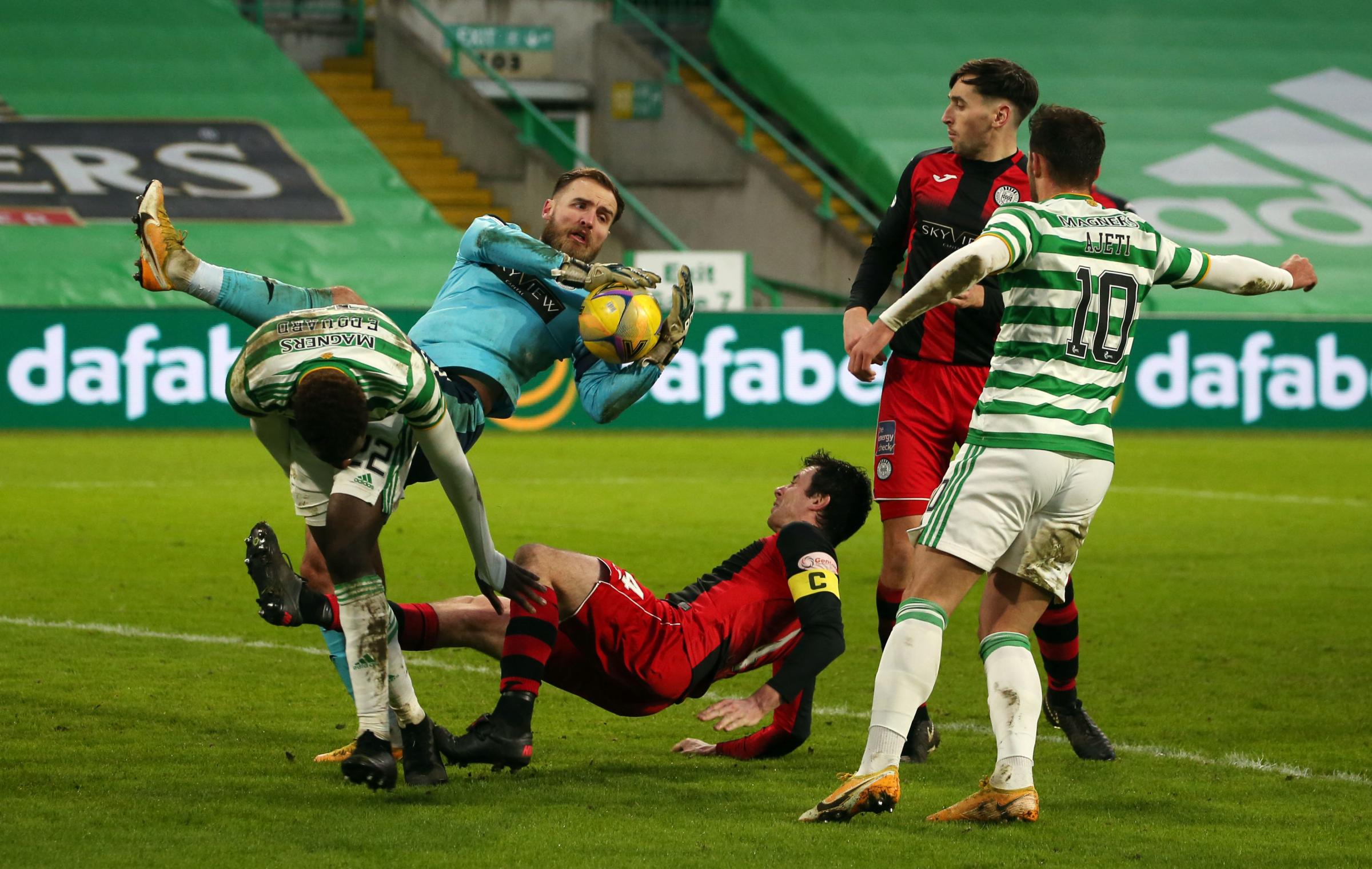 St Mirrens Jak Alnwick makes a save during the Scottish Premiership match at Celtic Park, Glasgow. Picture date: Saturday January 30, 2021. PA Photo. See PA story SOCCER Celtic. Photo credit should read: Andrew Milligan/PA Wire. RESTRICTIONS: Use subjec