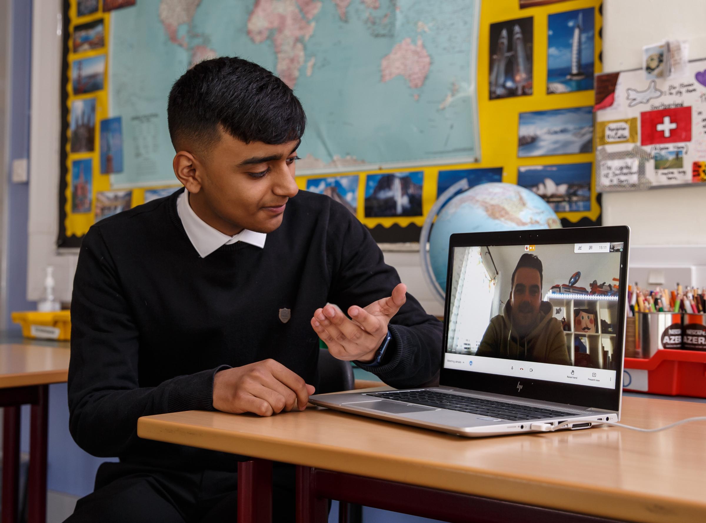 Awish Ul Haq at Bellahouston Academy pictured with his MCR Pathways mentor John Campbell during a video meeting Picture: Colin Mearns