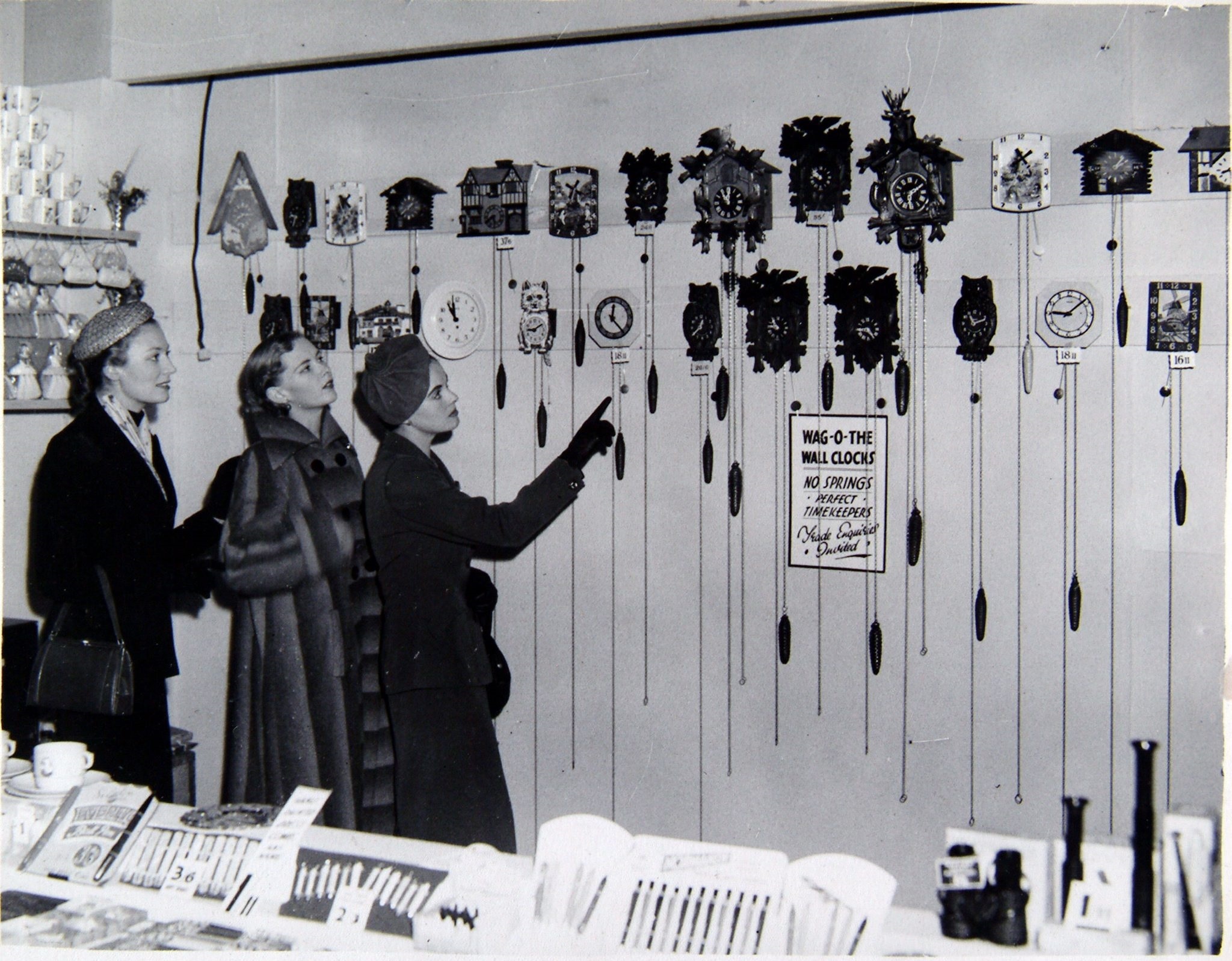 Admiring the cuckoo clocks at the Modern Homes Exhibition in the Kelvin Hall in 1951. Pic: Herald and Times