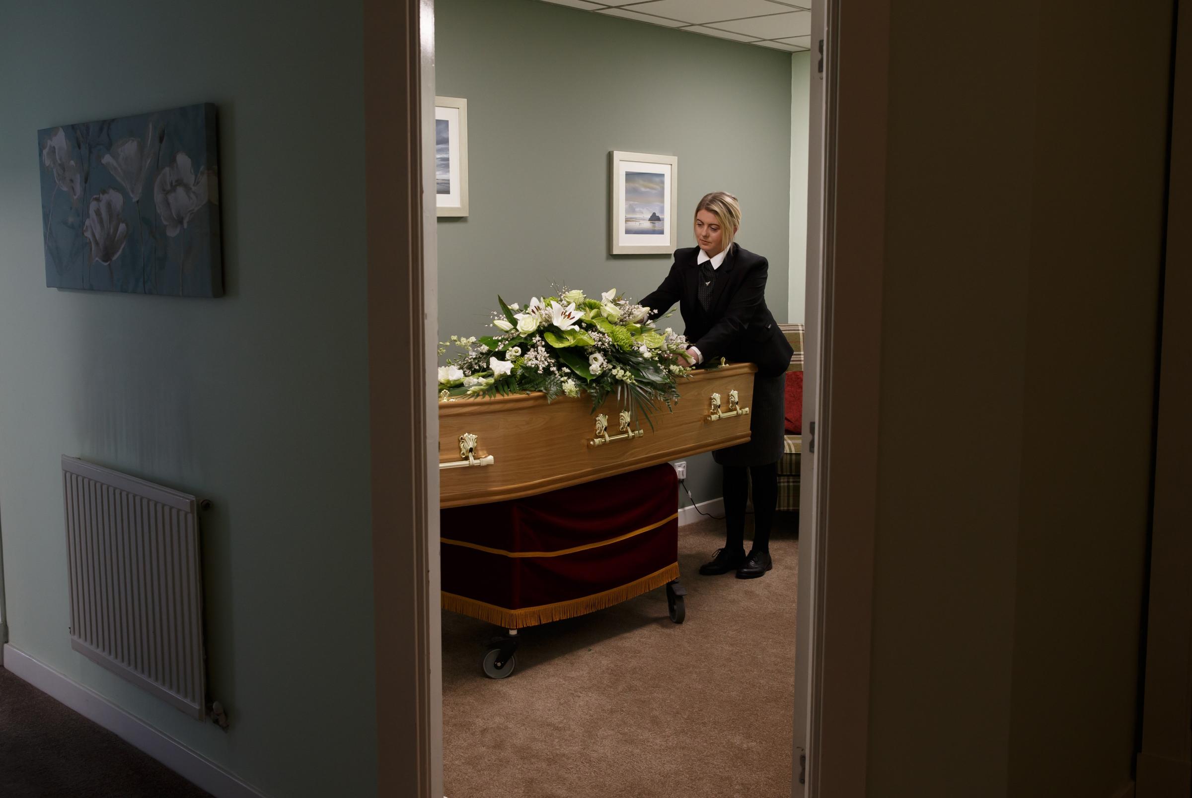 Funeral director Linda McGreskin in the viewing room at T&R OBrien with a display coffin Picture: Colin Mearns