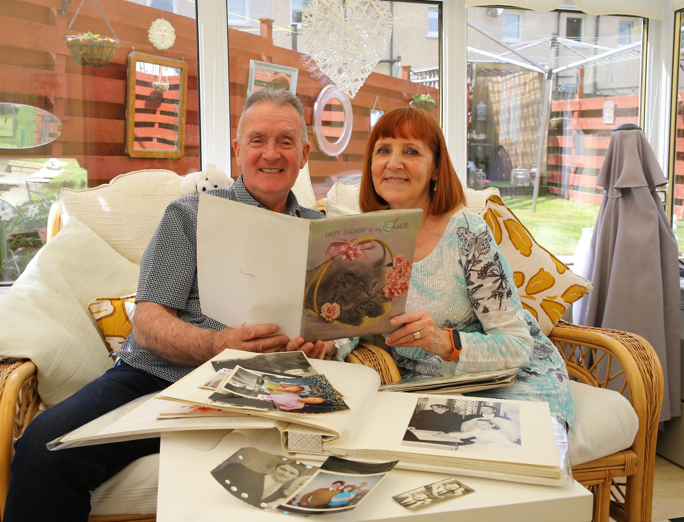 Glasgow Times past feature. Isabel and Brian McNulty pictured at home in Milton, Glasgow. The couple have been together for 53 years after meeting at school, courting at the dancing, and marrying at 18. They are holding a birthday card that Brian gave to