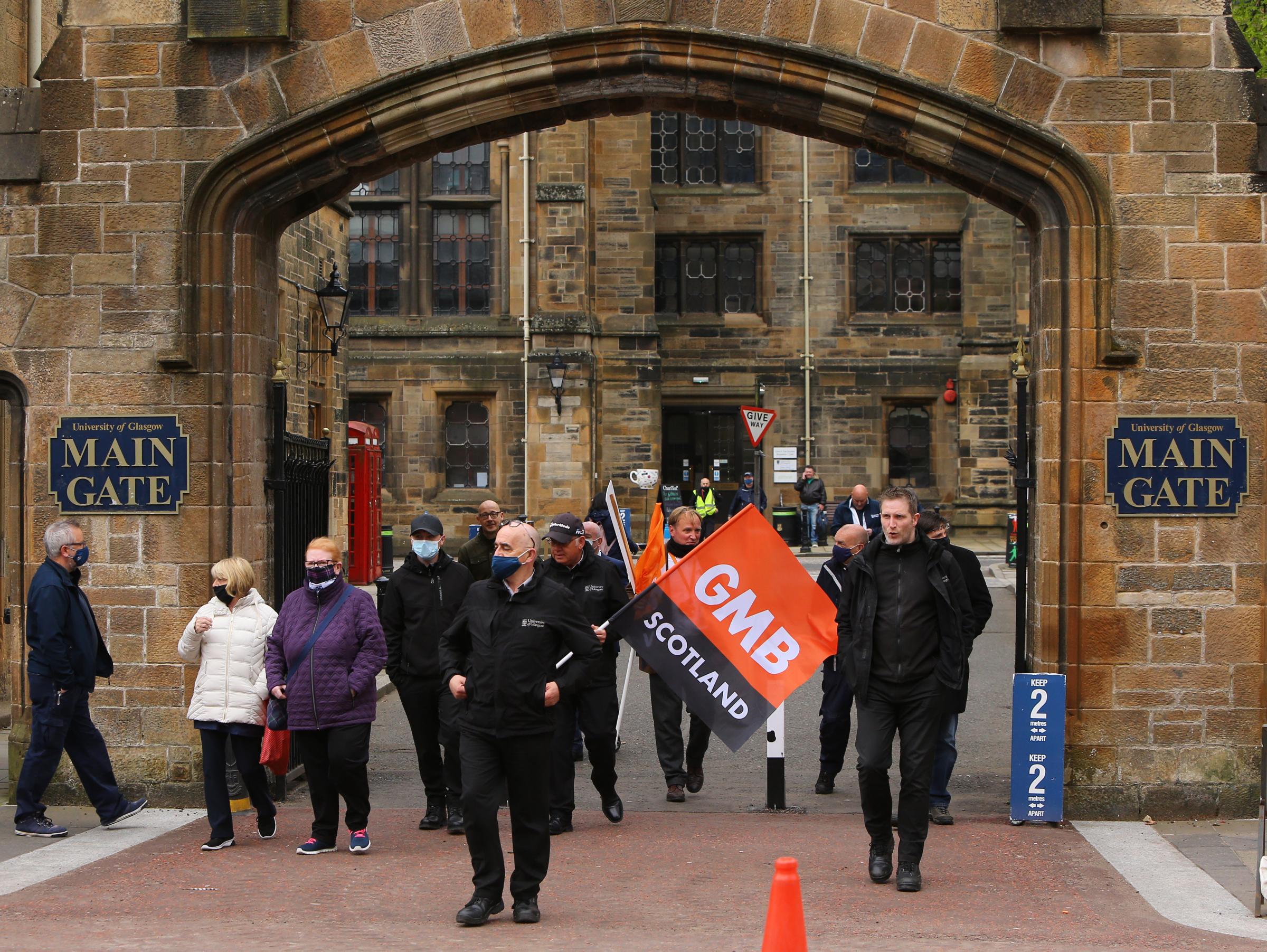 University of Glasgow GMB and Unite union members including janitors and other support staff pictured walking down University Avenue led by a piper Picture: Colin Mearns.13 May 2021