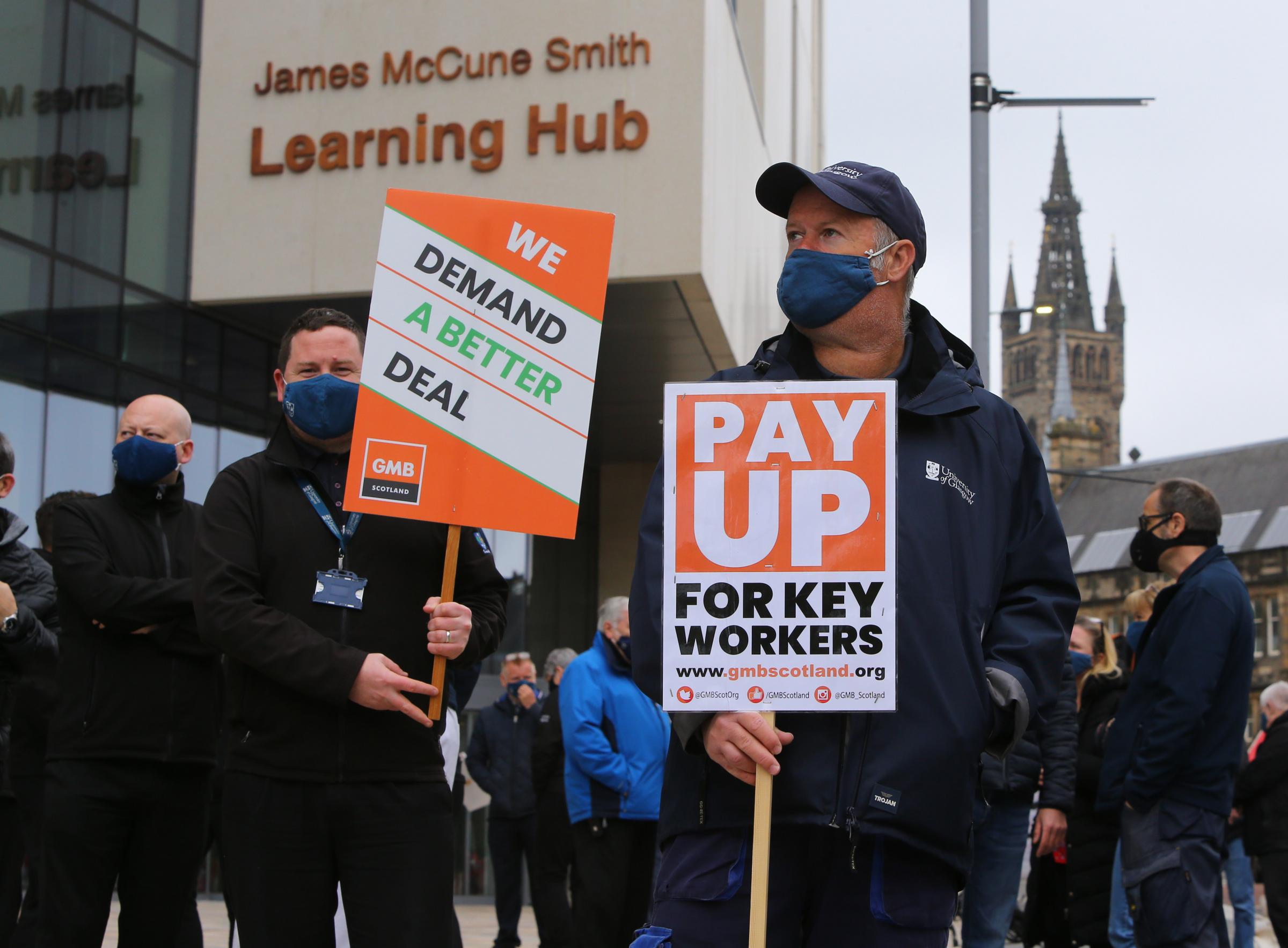 University of Glasgow GMB and Unite union members including janitors and other support staff pictured walking down University Avenue led by a piper Picture: Colin Mearns.13 May 2021