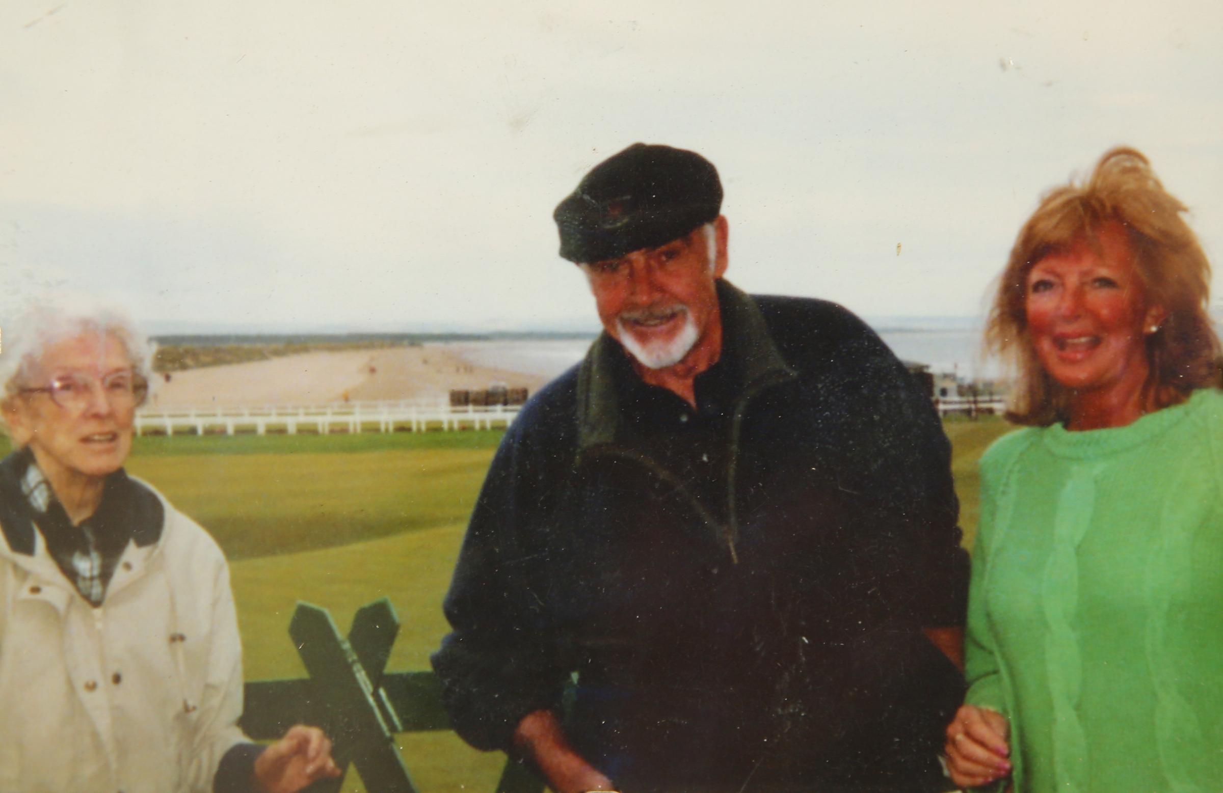 Margot Burkhill, right, pictured with Sean Connery at St Andrews. Re Times Past feature. At left is Margots aunt Greta... Photograph courtesy of Margot Burkhill..For GT Times Past, see story by Ann Fotheringham..