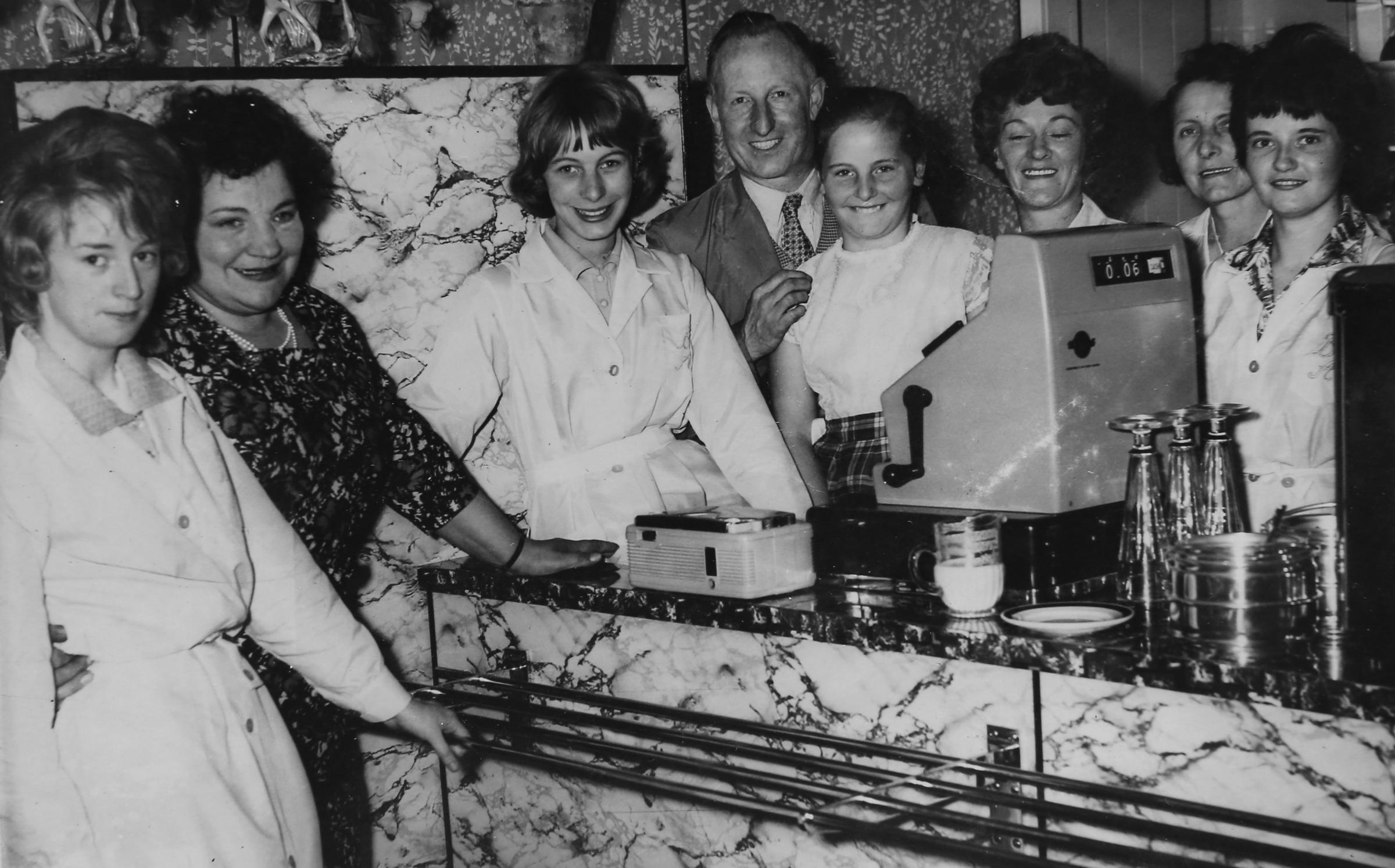 Copy of a photograph supplied by Lee Conetta, owner of Buon Appetito in Rutherglen showing her along with her sister and parents and staff members in the original Buon Appetito on the Main Street, Rutherglen in 1963. Pictured is Lee who is 3rd from left,