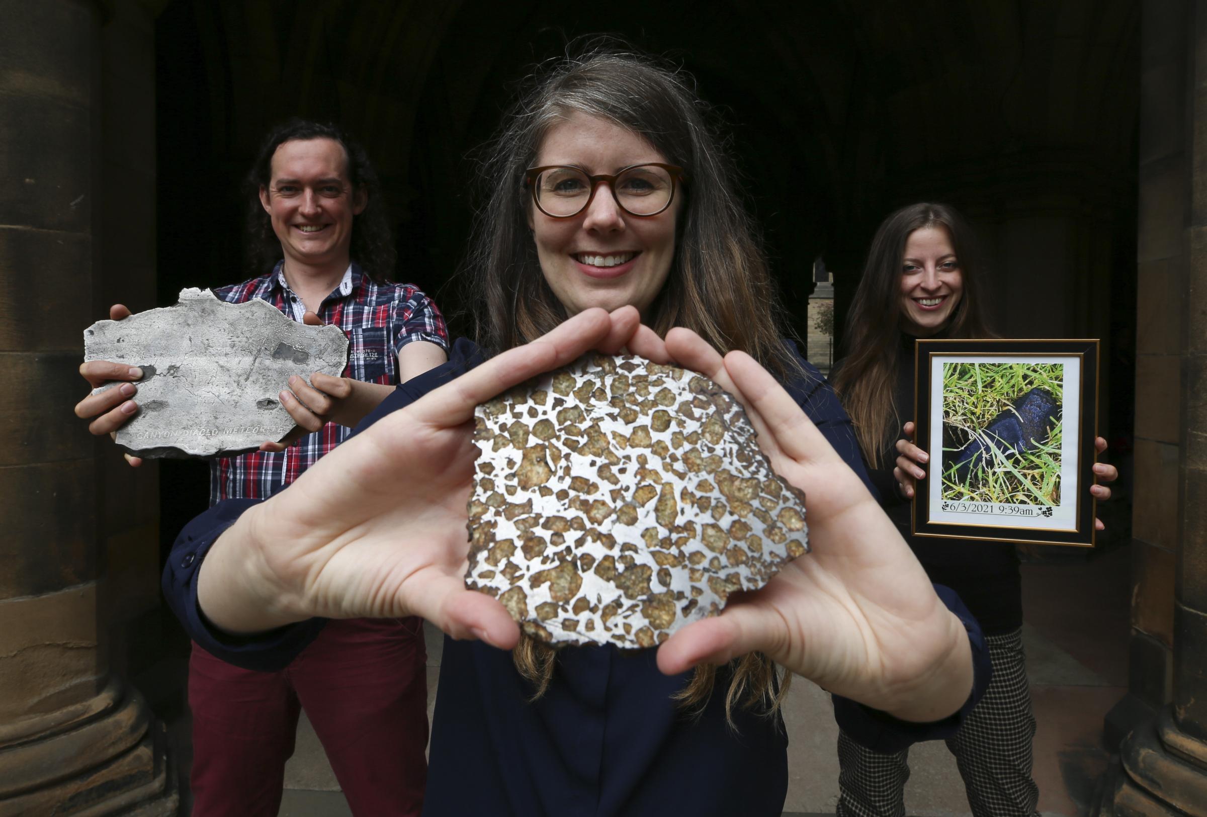 Glasgow University researcher Luke Daly with partner Mire Ihasz and scientist Aine OBrien hold meteorites from the Hunterian Museum Picture: Gordon Terris