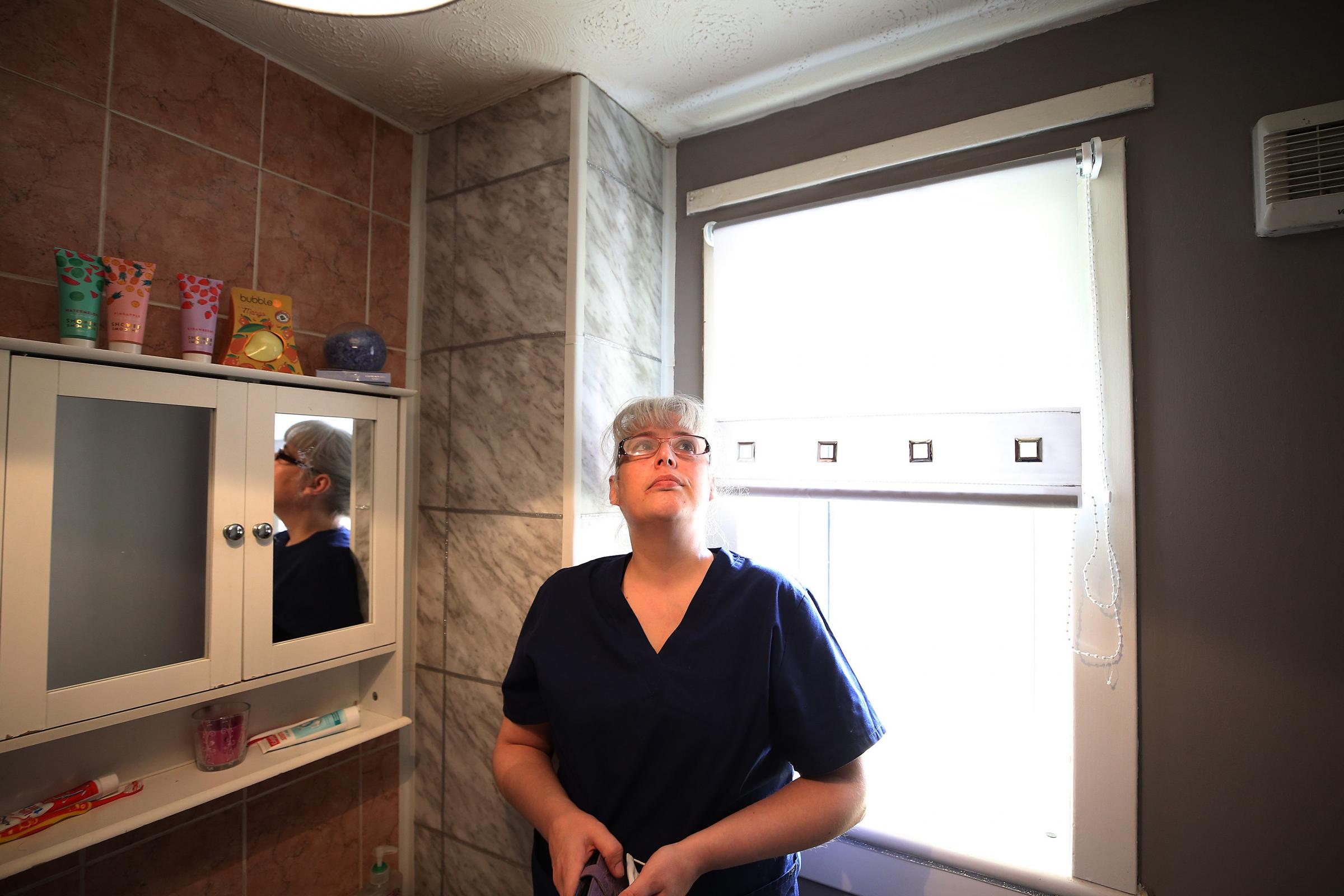 Angela McCabe whose flat in Toryglen has been flooded from above for months in her bathroom and kitchen Picture: Gordon Terris