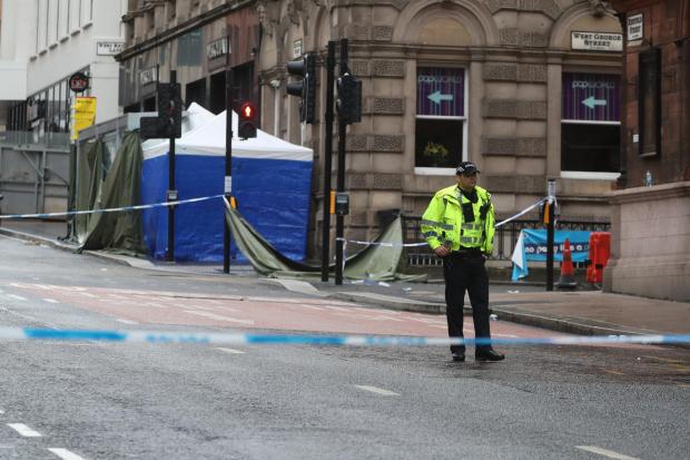 Glasgow Times: [Photograph: PA Media] Police Incident tent at the scene in West George Street, Glasgow