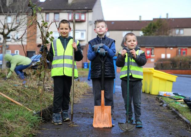 Glasgow Times: Young members of Denmilne Community Action Group in Easterhouse (l-r) Piotr Slizowski, 8, Mason Watson, 9 and Filip Slizowski, 6. Pic: Colin Mearns