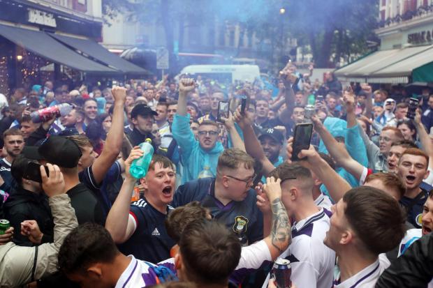 Glasgow Times: Scotland fans pictured in Leicester Square ahead of the England v Scotland match on June 18. 