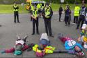 'May use proportionate force': Police make arrests of members of a Scots nuclear base human blockade