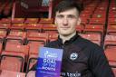 Thistle goalkeeper Jamie Sneddon with his goal of the month award