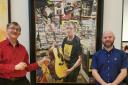 Tommy Robertson (left) and Michael Youds with the 'Labour of Love' portrait at the Scottish National Portrait Gallery