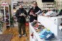 Robert Stewart, left and Alan Lynn, right, owners of Sneakers ER, Sneaker Laundry. Robert is holding a New Balance 992 (WTAPS) trainer and Alan is holding a original vintage Air Jordan 1 BRED from 1985.