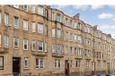 Top-floor flat in 'vibrant' Glasgow area on sale for £105k
