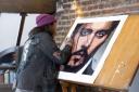 Johnny Depp signing his self-portrait