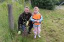 Wheatley Group Chief Executive Steven Henderson plants trees with Olivia Woods, five, from Just Be Kids nursery in Darnley