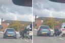 Two men seen getting out of their cars on busy road to start 'scrapping'