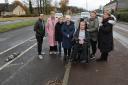 Pictured on Wallacewell Road, Balornock, Glasgow are from left- Cllr Thomas Rannachan, Cllr Maureen Burke, local residents Cathy McCann, Georgina McReynolds, Stuart Coll, Joanne Coll and Cllr Audrey Dempsey. At left is an 'armadillo' .