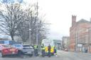 Two cars 'crash into fence' on busy road in Glasgow