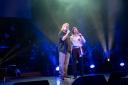 Blair Cunningham singing with his idol, John Owen-Jones, on stage in Glasgow