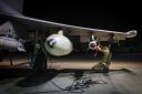 An RAF technician works on a Typhoon jet in a photo issued by the MoD