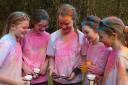 Lexi McElwaine, Ava-Grace Charles, Sarah Wilson, Zoe Graham and Ellie-Grace Condell browsing some photos that friends took of the colour run.
