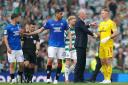 Celtic goalkeeper Joe Hart, right, shakes hands with Rangers manager Philippe Clement, second right, at Hampden today as Ibrox defender Leon Balogun, second left, holds his team mate Nicolas Raskin, left back