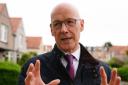 First Minister John Swinney has said the SNP will push a Labour government left