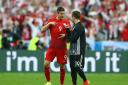 Robert Lewandowski of Poland, left, and Mario Gotze of Germany talk after their scoreless draw in the Euro 2016 match last night.