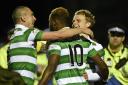 Moussa Dembele celebrates with team-mates Scott Brown and Gary Mackay-Steven after scoring Celtic's second of the night