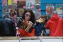 Record Fair 1 SA : The VIP record fare returns to Glasgow Ã  thousands of old CDs + vinyl on sale, covering every musical genre at Bellahouston leisure centre, Glasgow...Nicole Frame with her 2yr old daughter Maisie..Picture by Stewart Attwood.          