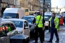 Picture Nick Ponty 30/1/15.Sauchiehall Street is the highest yielding street in Glasgow for parking charges and penalties. A parking warden speaks to motorists.