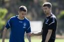 Jordan Rossiter speaks to his manager Steven Gerrard at Rangers training camp in Spain