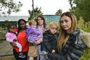 PAISLEY, SCOTLAND - SEPTEMBER 17: parents L-R: Ibironke Embuka with Naomi (2), Donna Baird with Sarah (2) and Claire Caddis with Jax (2) pose for a photograph in front of Hillview nursery in the Ferguslie Park area of Paisley on September 17, 2018 in Pais