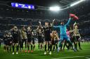 Ajax players celebrate victory at the Bernabeu