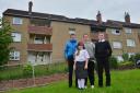.Kelly Scullion and her children Aidan 15, Finn 13 and Keavy 11 stand outside their burnt out apartment block at Muirbrae way, Rutherglen. They have no idea when they will be able to return....Kirsty Anderson Newsquest Herald and Times .13/06/19..........