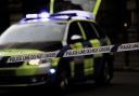 Boy, 14, arrested after 'assault' as police tape off road