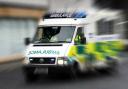 Woman rushed to hospital after crash involving car and bus