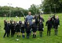 Pupils at St. Clare's Primary School, Drumchapel with Depute head Martin Muir as they clean up some of the litter on their school grounds...Picture Robert Perry 30th September 2021..FEE PAYABLE FOR REPRO USE.FEE PAYABLE FOR ALL INTERNET